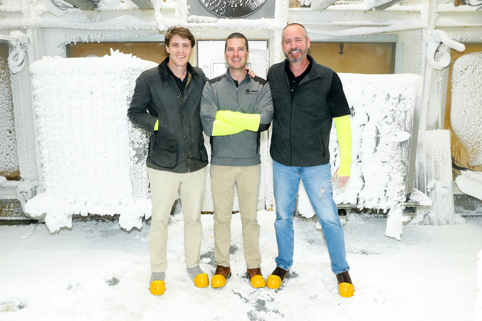 Three HVAC engineers stand in a frozen equipment room at Perry Tillman TM Air Engineers in Birmingham, AL.