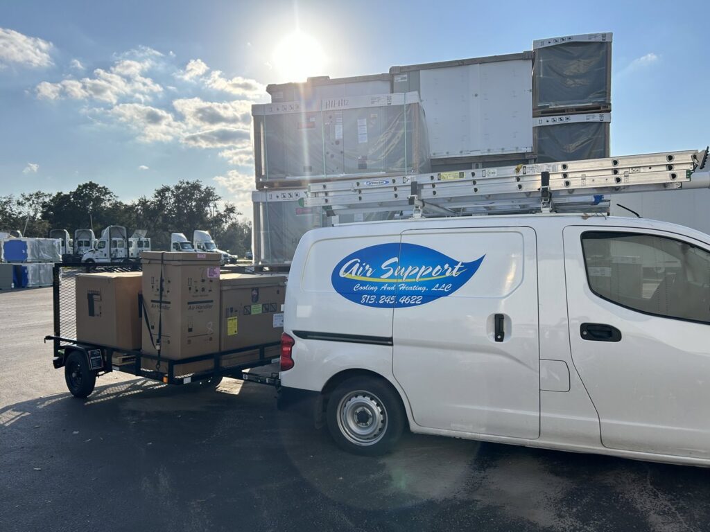 Air Support Cooling and Heating, LLC van with a trailer delivering new HVAC equipment for installation in Tampa, FL
