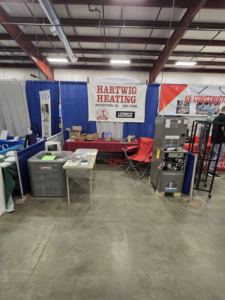 A display of HVAC equipment, including a furnace and AC unit, by Hartwig Heating in Marshalltown, IA