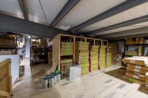 An organized warehouse storing HVAC equipment and supplies for Prudhom Mechanical LLC in Edmond, OK