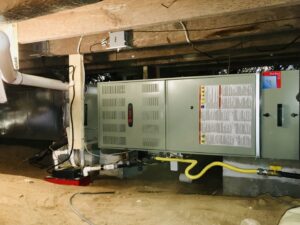 An HVAC furnace and air handler unit installed in a crawl space or basement by Modern Mechanical HVAC in Garner, NC.