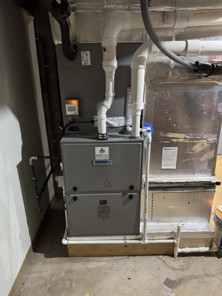 A newly installed HVAC furnace and air handler unit with ductwork by C&A HVAC LLC in Springfield, PA.