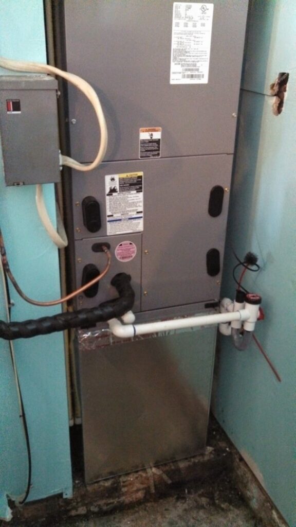 An HVAC furnace and air handler unit installed in a utility closet by Turner & Son's Heating and Air in Anderson, IN
