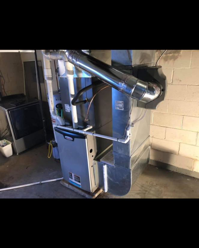 An HVAC furnace unit with extensive ductwork installed by Tru-Sky Heating & Cooling in Pittsburgh, PA.