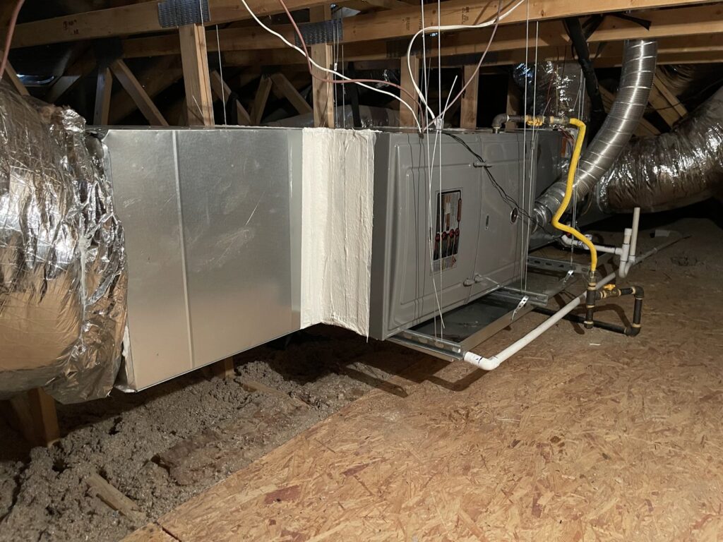 A complete HVAC furnace and ductwork system installed in an attic by J & M Cooling & Heating LLC in Peoria, AZ.