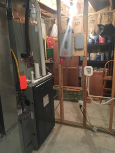 An HVAC furnace and tankless water heater installation in a utility room by James HVAC LLC in Georgetown, DE.