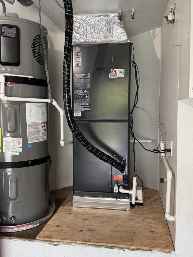 A complete HVAC furnace and water heater system installed in a utility area by Pelican Heating and Air in Carlsbad, CA.