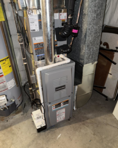 An HVAC furnace unit and water heater installed by Tru-Sky Heating & Cooling in Pittsburgh, PA.