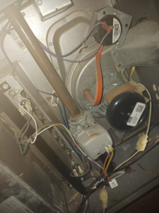 Detailed view of HVAC furnace blower motor and internal components by Higher Peak Air Conditioning and Heat, LLC 1 in Houston, TX