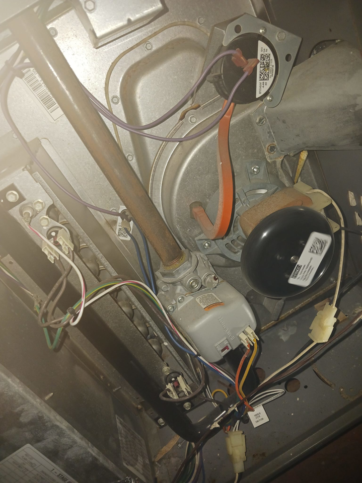 Detailed view of HVAC furnace blower motor and internal components by Higher Peak Air Conditioning and Heat, LLC 1 in Houston, TX