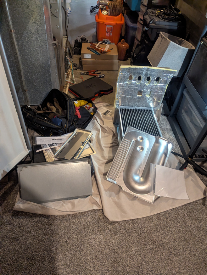 Various HVAC furnace and ductwork components laid out for installation or repair by Polaris Heating and Cooling in Columbus, OH.