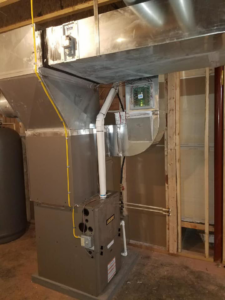 An indoor HVAC furnace and ductwork installation by L.E. Davis Heating & A/C in Hagerstown, MD.