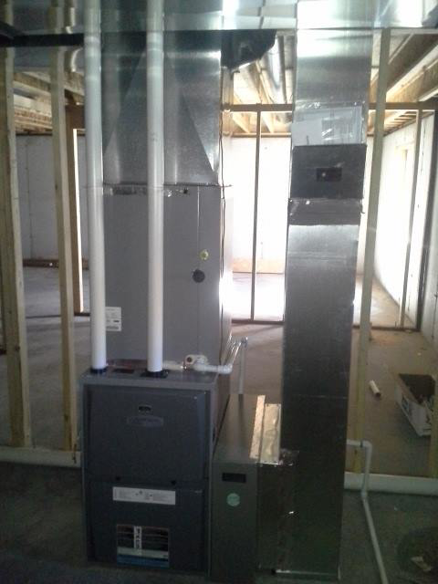 HVAC furnace and ductwork installation in a residential basement by Northwest Heating and Air Conditioning in Helena, MT.