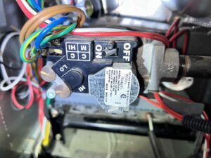 A close-up view of an HVAC furnace gas valve and wiring by Residential Express Heating & Air in Sterling, VA.