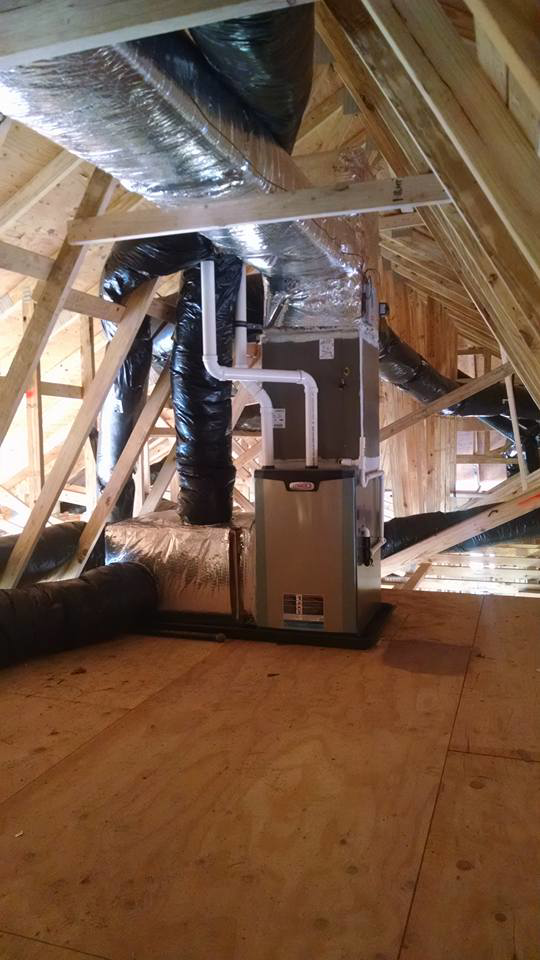 An HVAC furnace and ductwork installation in an attic by Legendary Mechanical LLC in Toms River, NJ.