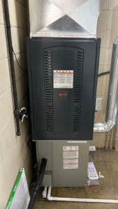 A newly installed Trane furnace and air handler unit with ductwork by C&L Heating and Air in Louisville, KY.