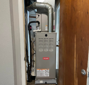 A Bryant HVAC furnace unit professionally installed in a utility closet by Bowmans Heating and Air LLC in Middletown, KY