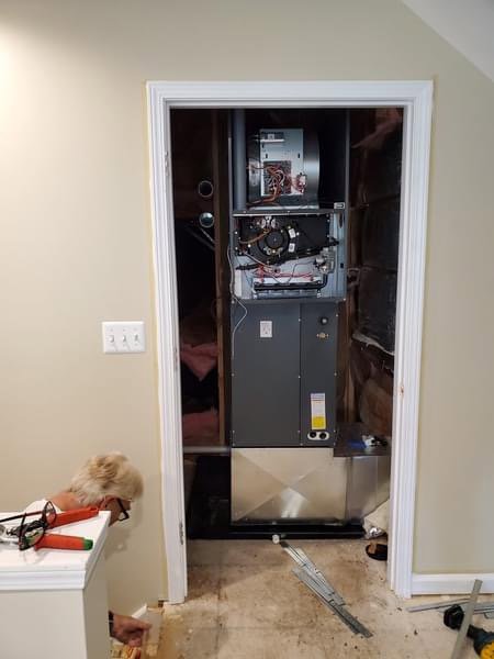 An HVAC furnace unit being installed in a utility closet by Perfect Comfort Systems in San Bernardino, CA