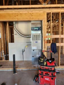 An HVAC furnace and ductwork being installed in a new construction home by Greens Heating & Air Conditioning, Douglasville, GA.