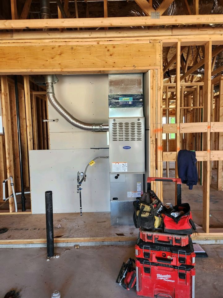An HVAC furnace and ductwork being installed in a new construction home by Greens Heating & Air Conditioning, Douglasville, GA.