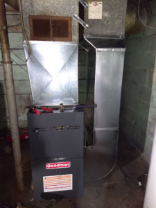 HVAC furnace and ductwork installation with tools on top by PM Construction in Loves Park, IL.