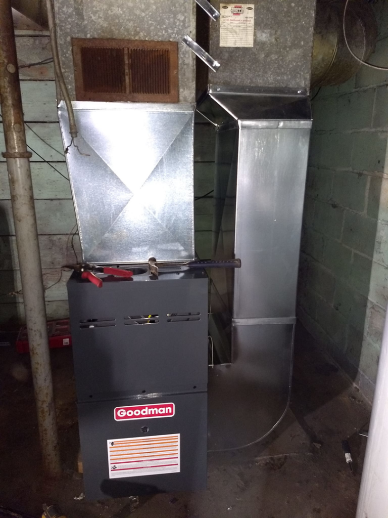 HVAC furnace and ductwork installation with tools on top by PM Construction in Loves Park, IL.