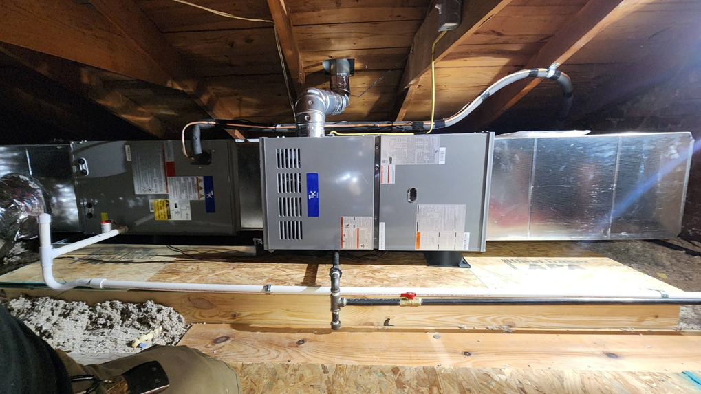 A newly installed indoor HVAC furnace and air handler unit by Xtreme Heating & Cooling in Tulsa, OK