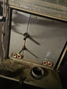 The interior components of an HVAC furnace during maintenance or repair by Astron Services LLC in Wichita, KS.