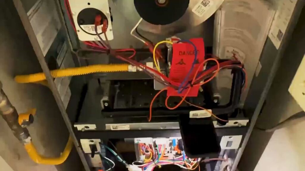 Close-up view of the interior wiring and components of an HVAC furnace by Anderson Mechanical Inc. in Pascagoula, MS