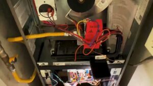Close-up view of the interior wiring and components of an HVAC furnace by Anderson Mechanical Inc. in Pascagoula, MS