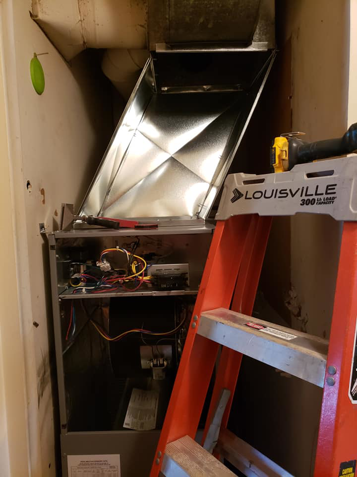 An indoor HVAC furnace unit undergoing repair and maintenance by Kopetsky HVAC in Indianapolis, IN.