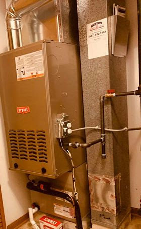 An HVAC furnace system with ductwork installed by Kustom Heating & Cooling in Elgin, IL