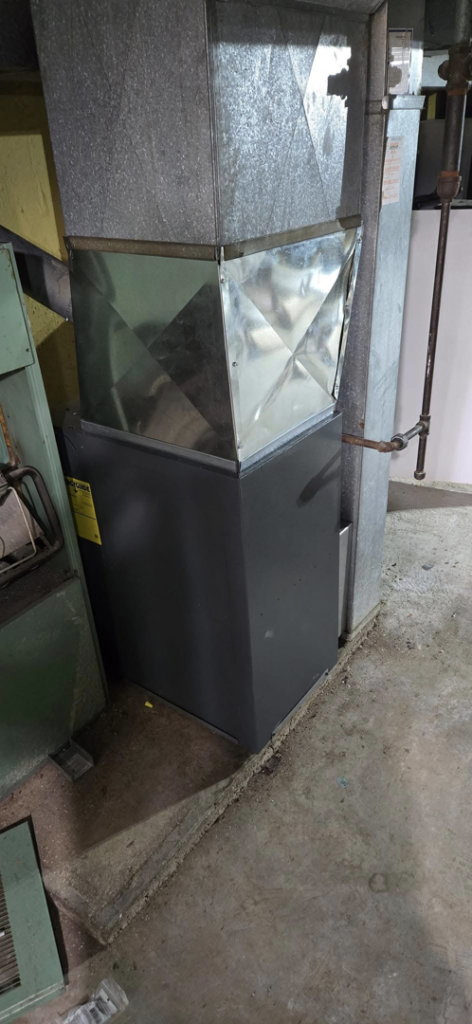 A residential HVAC furnace unit with connected ductwork installed by McBride HVAC Solutions LLC in Cincinnati, OH