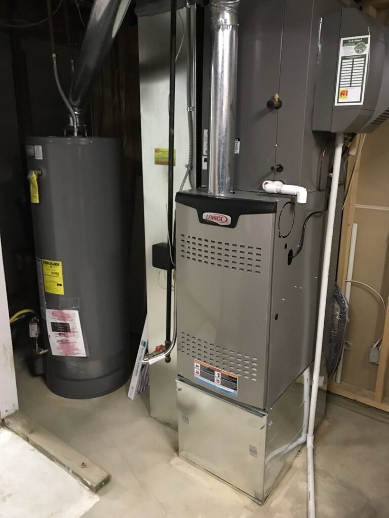 A new Lennox HVAC furnace and water heater installed in a utility room by A-1 Heating and Air Conditioning Service in Alexandria, VA