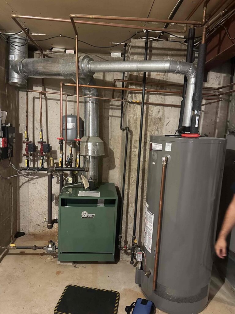A newly installed HVAC furnace and water heater system with ductwork and piping by Air Docs Inc. in Vero Beach, FL