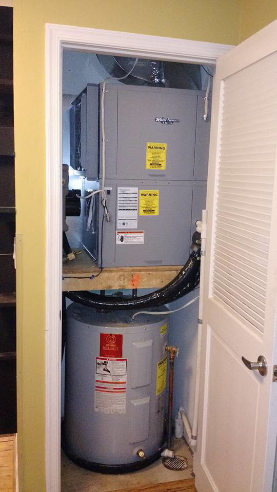 An indoor HVAC furnace and water heater installation by Rowan Heating and Air Conditioning, Inc. in Highland, MD