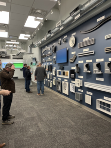 A display of various HVAC grilles, diffusers, and vents at Buckley Associates, Inc. in Hanover, MA