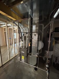 HVAC furnace and ductwork installation in a new construction basement by Omega Air Solutions in West Des Moines, IA.