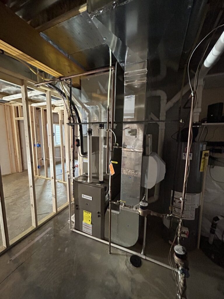 HVAC furnace and ductwork installation in a new construction basement by Omega Air Solutions in West Des Moines, IA.