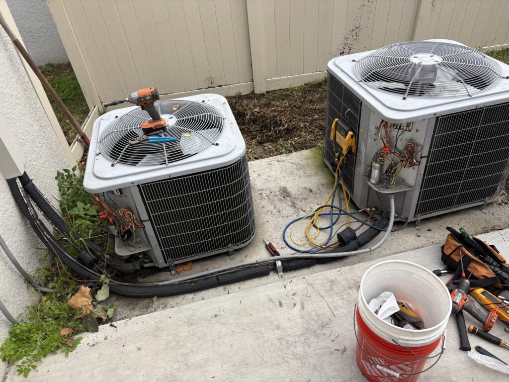 Tools and two outdoor AC units during an HVAC installation or service by Timely Air Conditioning in Riverview, FL.