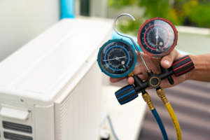 Close-up of HVAC manifold gauges used for refrigerant checks by Southside Energy in Chesapeake, VA.
