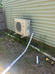 An HVAC outdoor condenser unit installation in progress by DD HVAC PROS in Charlotte, NC.