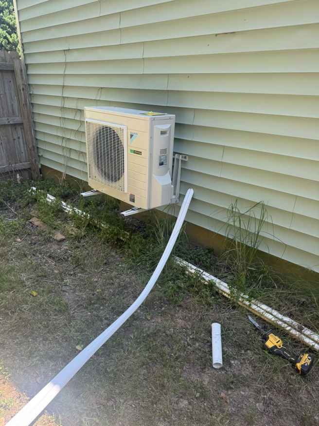An HVAC outdoor condenser unit installation in progress by DD HVAC PROS in Charlotte, NC.