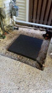 A prepared pad for an outdoor HVAC unit installation by Residential Express Heating & Air in Sterling, VA.