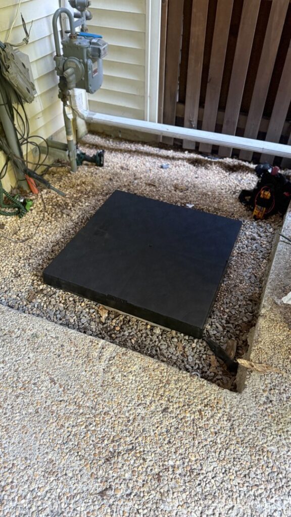 A prepared pad for an outdoor HVAC unit installation by Residential Express Heating & Air in Sterling, VA.