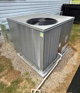 An outdoor HVAC unit installed on a gravel bed by Top Notch Heating and Air Conditioning in Bowling Green, KY.
