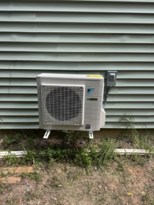 An HVAC outdoor unit with electrical connection completed by DD HVAC PROS in Charlotte, NC.