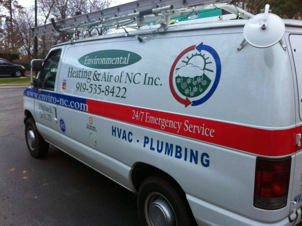 A branded service van for Environmental Heating & Air NC, featuring HVAC and plumbing services, seen in Cary, NC.