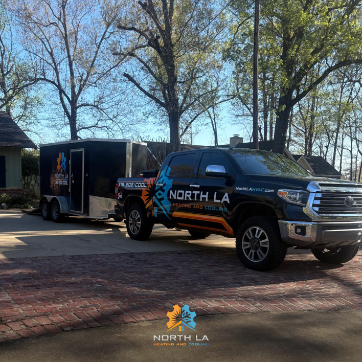 North LA Heating and Cooling service truck and trailer in a residential driveway in Monroe, LA, for HVAC repair.