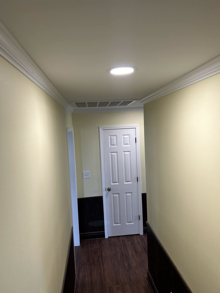 A newly installed HVAC return air vent in a hallway by S&S A/C and Electrical LLC in Houma, LA.